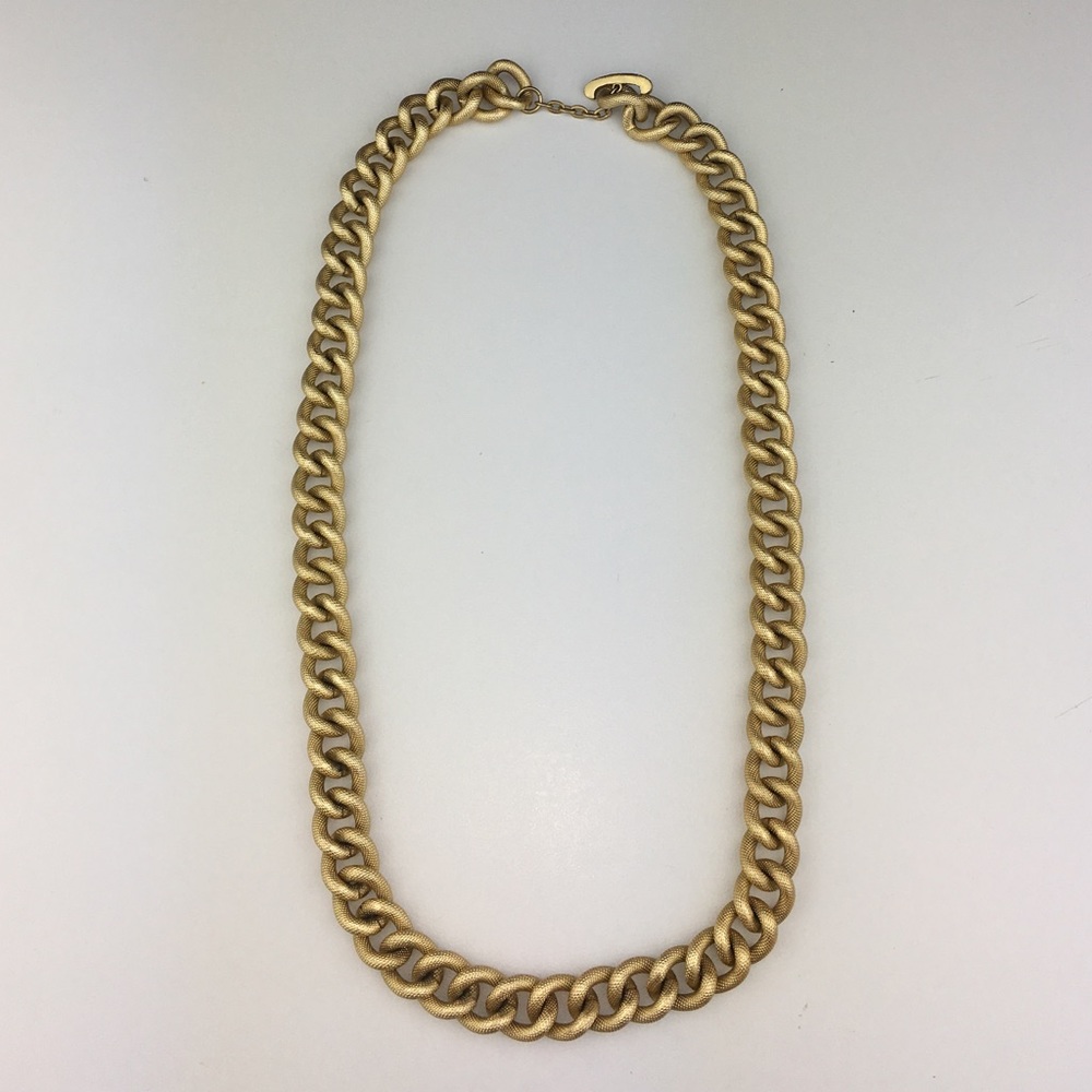 Gold toned chain linked necklace.
