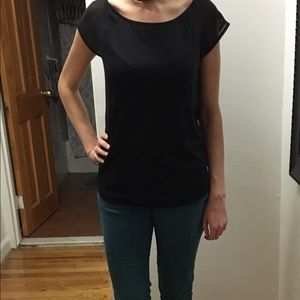 Soft black tee with tiny opening in back