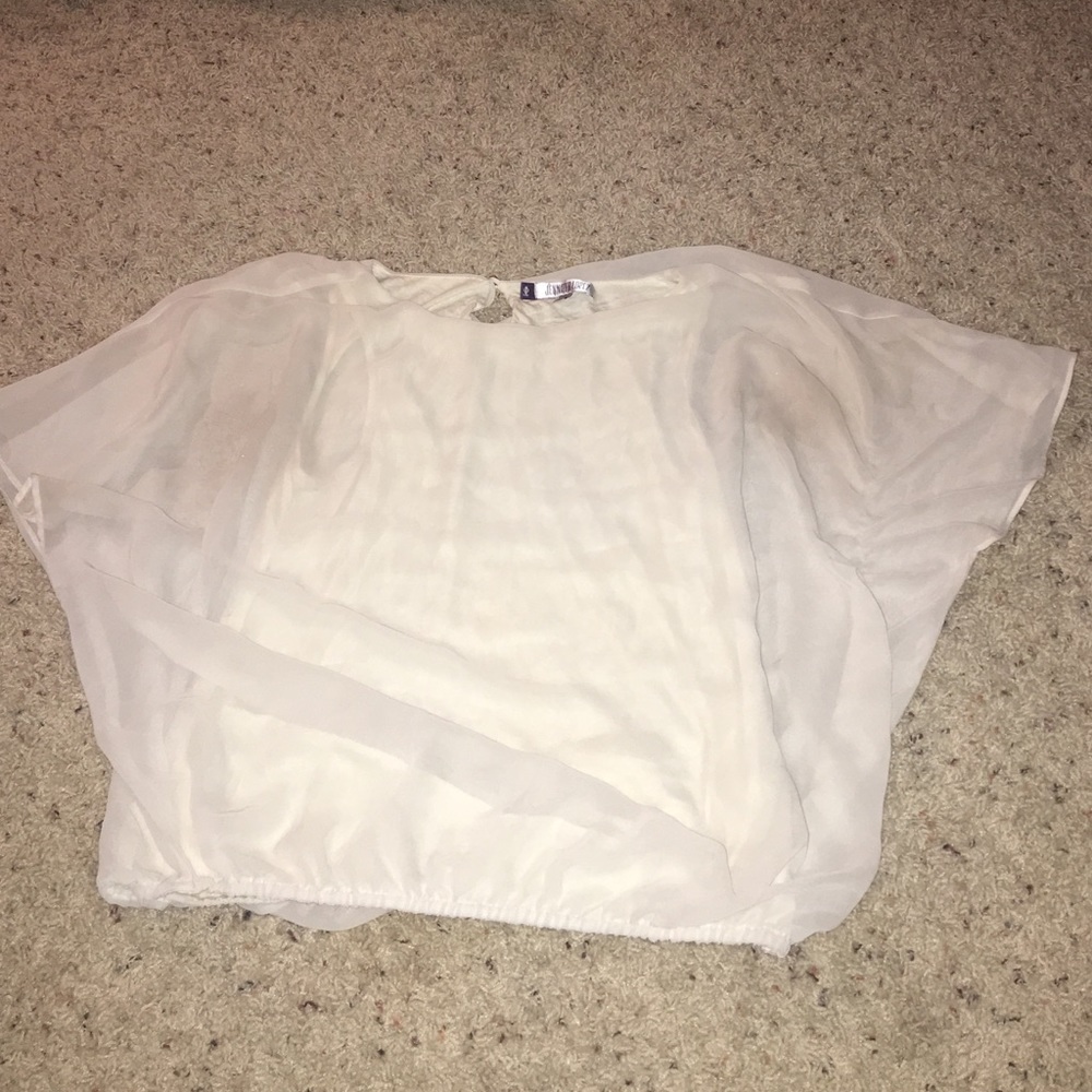 Flowly cream colored shirt gets tight at bottom