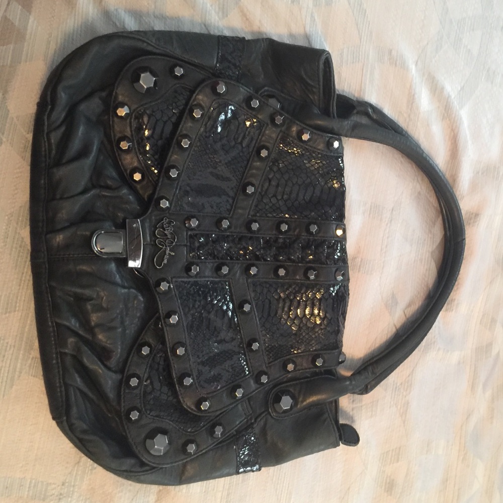 Betsey Johnson leather studded shoulder bag.