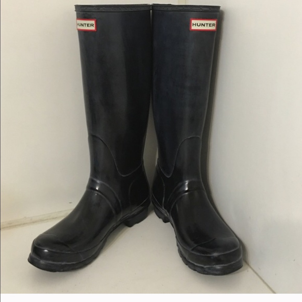 Black tall glossy hunter boots