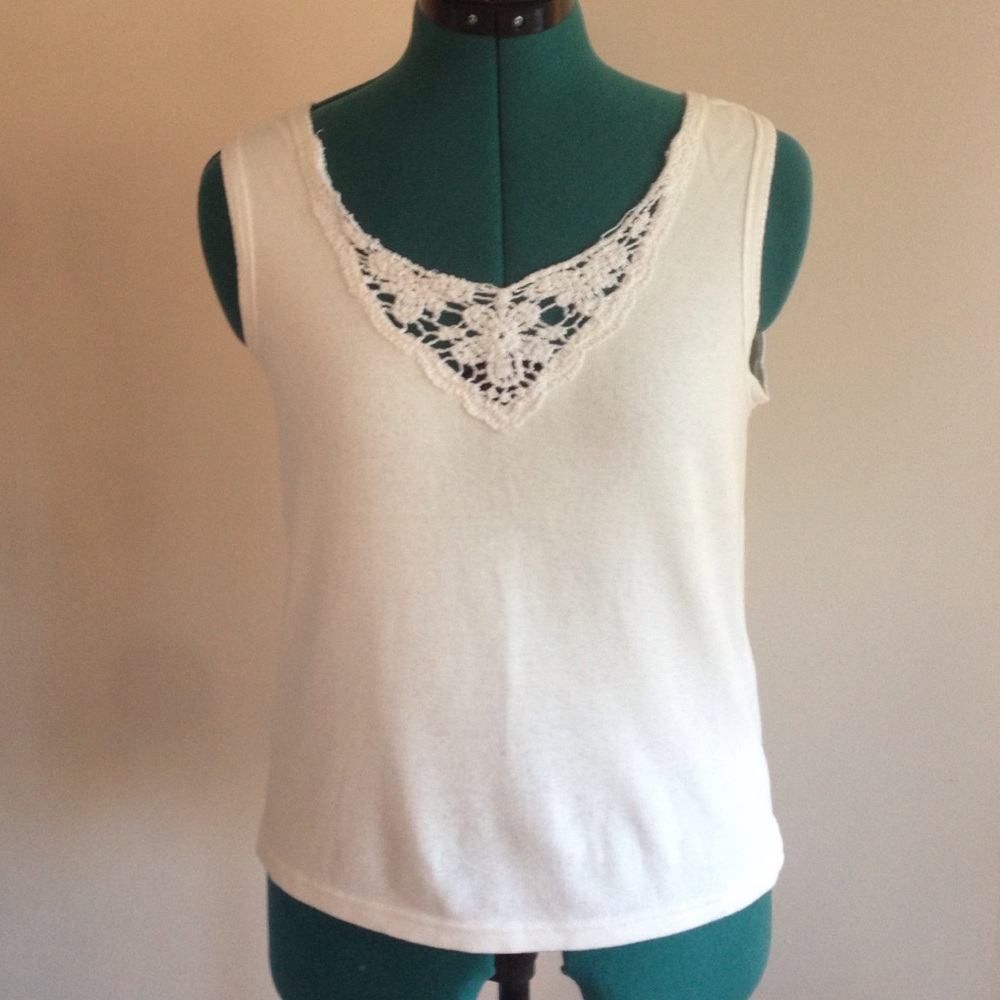 White tank top with neckline detail.