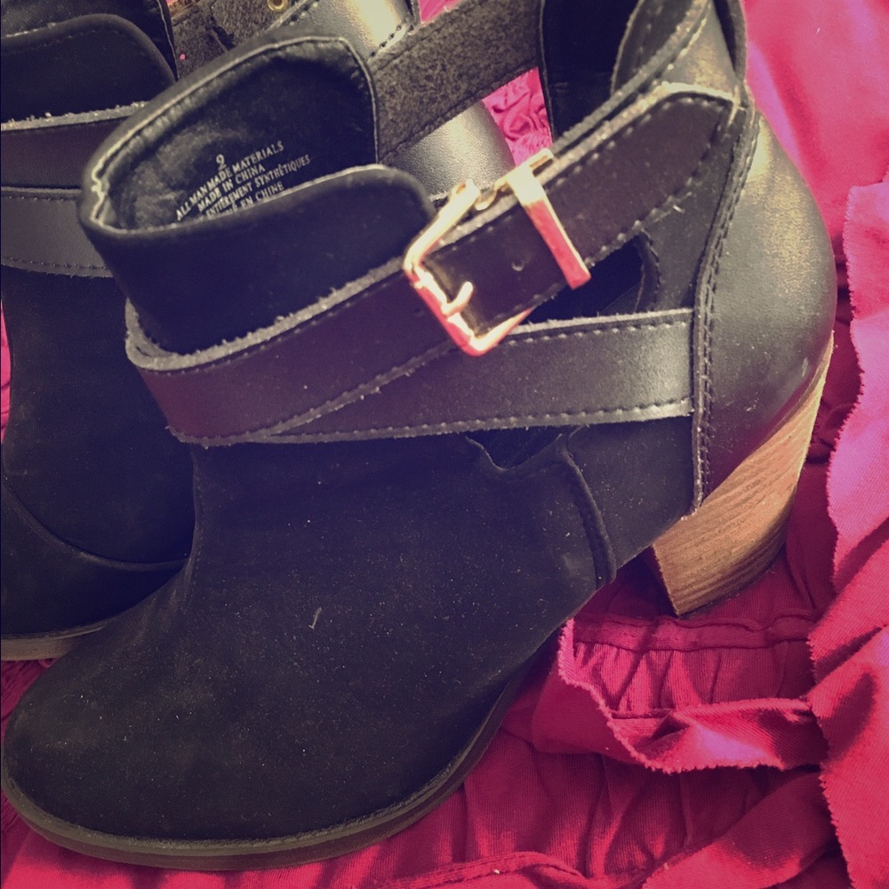 Stunning black booties with straps.