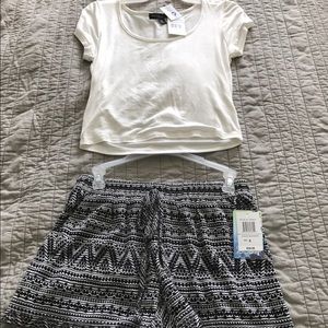 White crop top and black pattern shorts