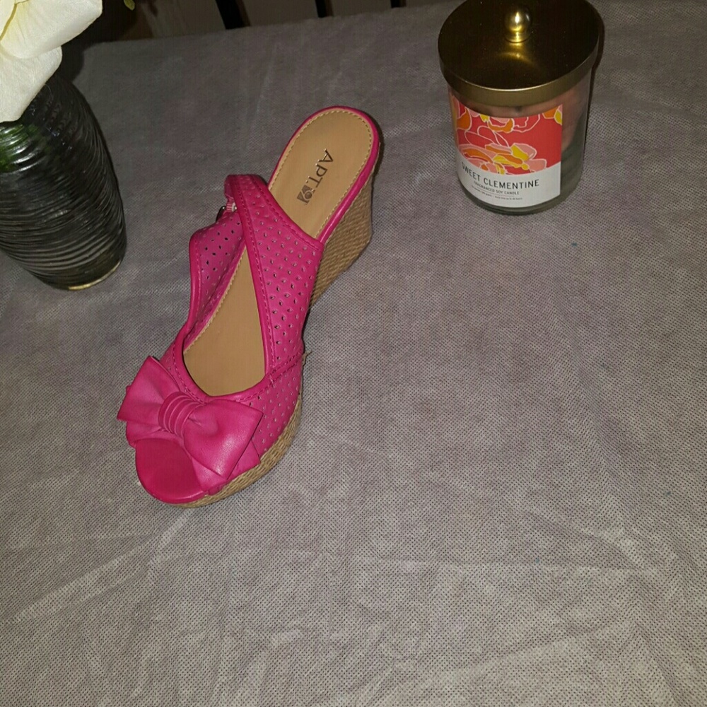 A hot pink wedge shoe. Brand: Apt. 9.