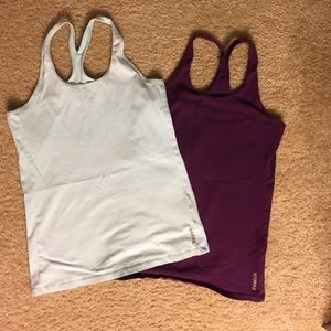 Two racerback Reebok tank tops size M