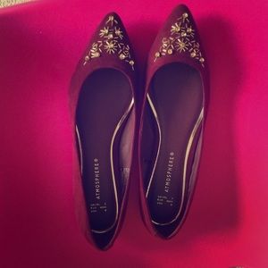 Dark maroon and gold flats