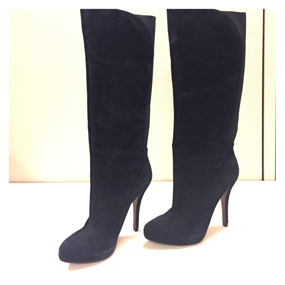 Black suede knee high boots.