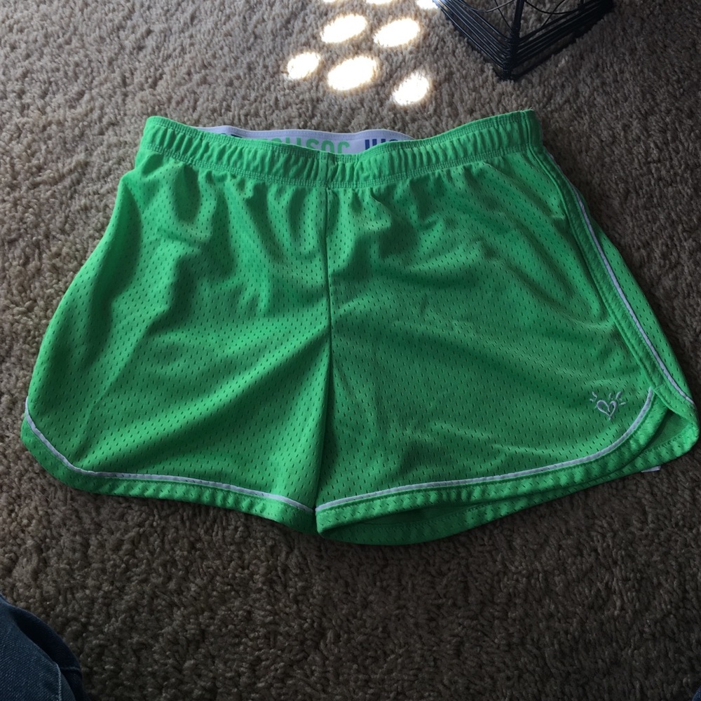 Green running shorts