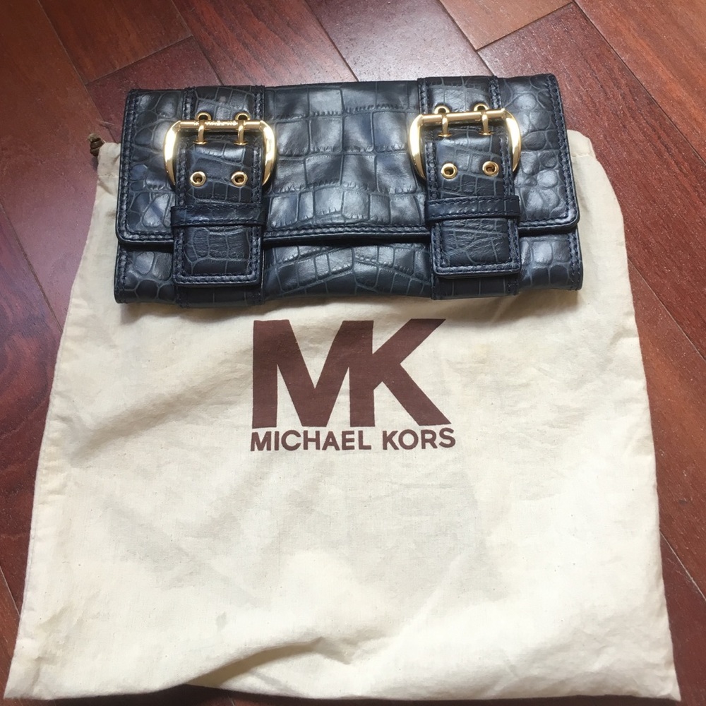 HOST PICK:  Michael kors clutch with gold buckle