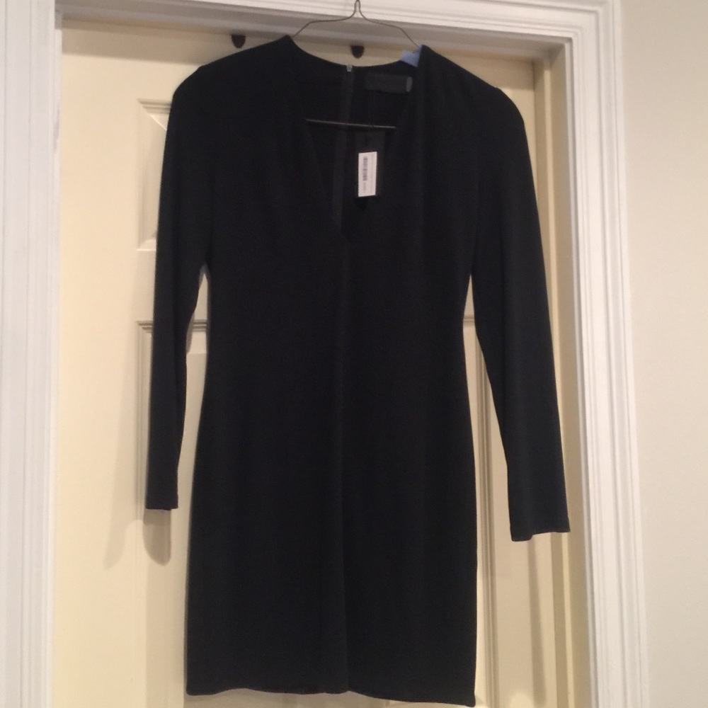 Saks black label, V neck, 35 in shoulder to hem.