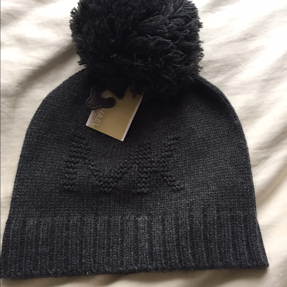 Grey Michael Kors beanie hat with pom pom