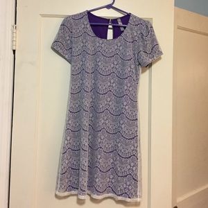 Purple dress with white lace overlay.