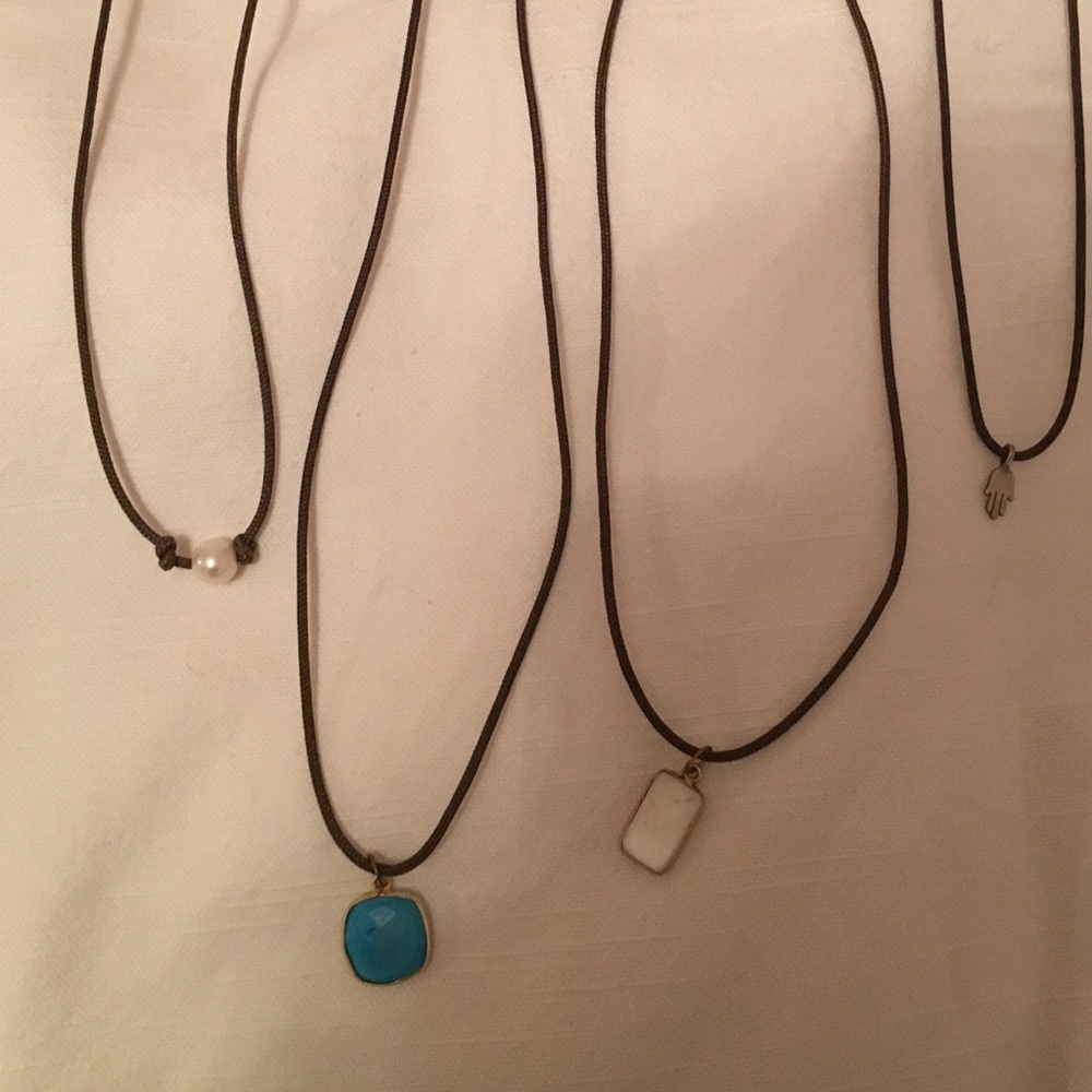 Leather cord necklaces with pearl enclosure