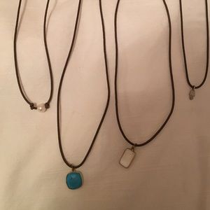 Leather cord necklaces with pearl enclosure
