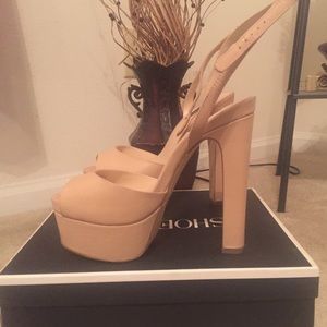 Nude platform pumps. *NEVER WORN*