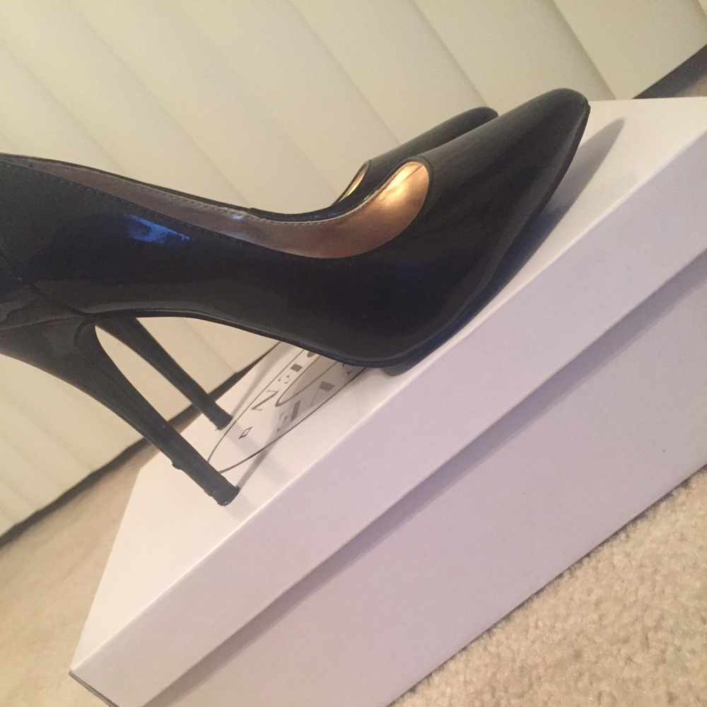 Steve Madden black patent leather pumps.