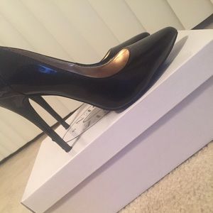 Steve Madden black patent leather pumps.