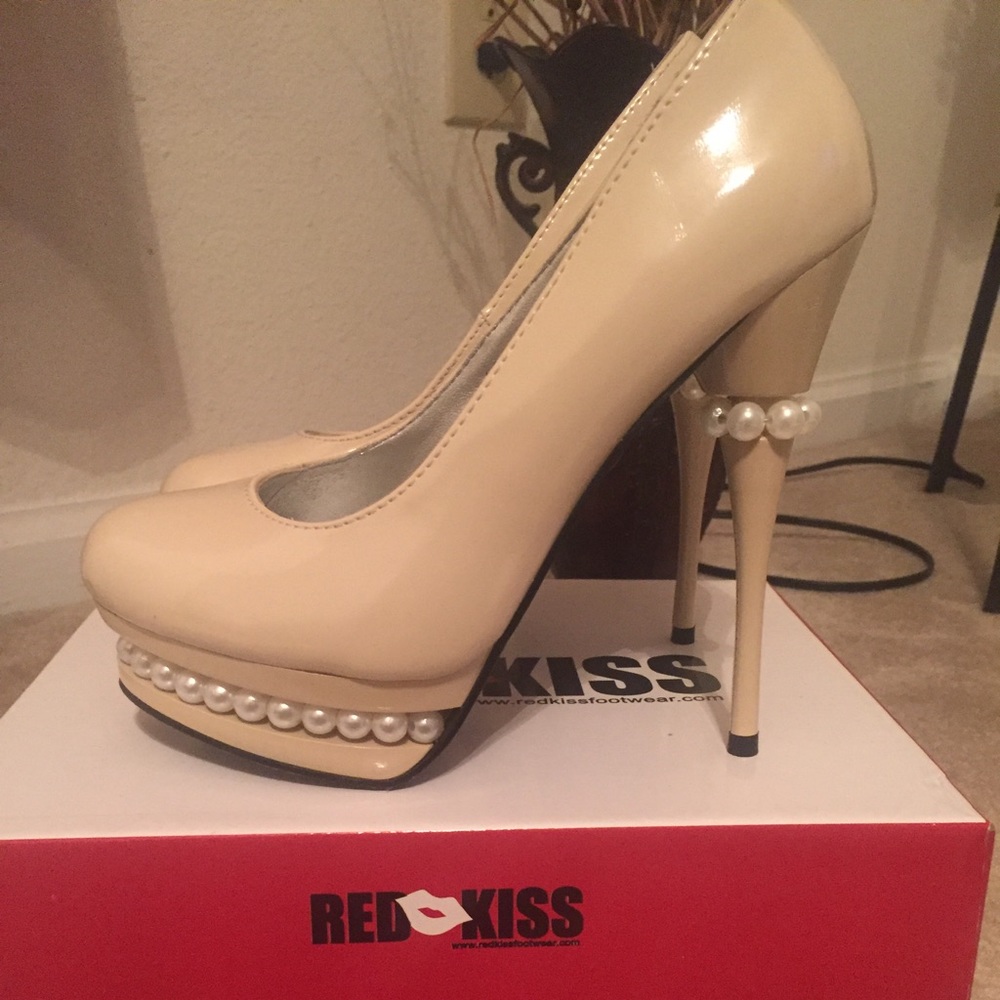 Nude pumps with pearl detailing.