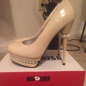 Nude pumps with pearl detailing.