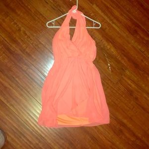 Back-less bright orange halter dress