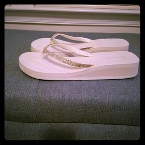White wedge flip flops with rhinestone straps