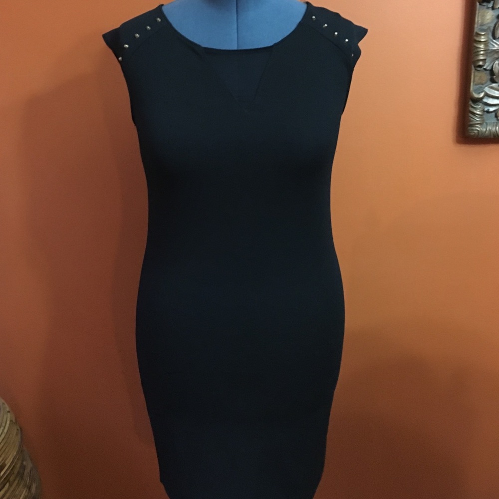 Black figure fitting dress.