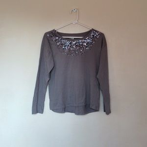 Lightly worn sequenced long sleeve top