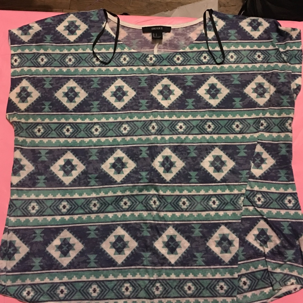 A Aztec designed shirt