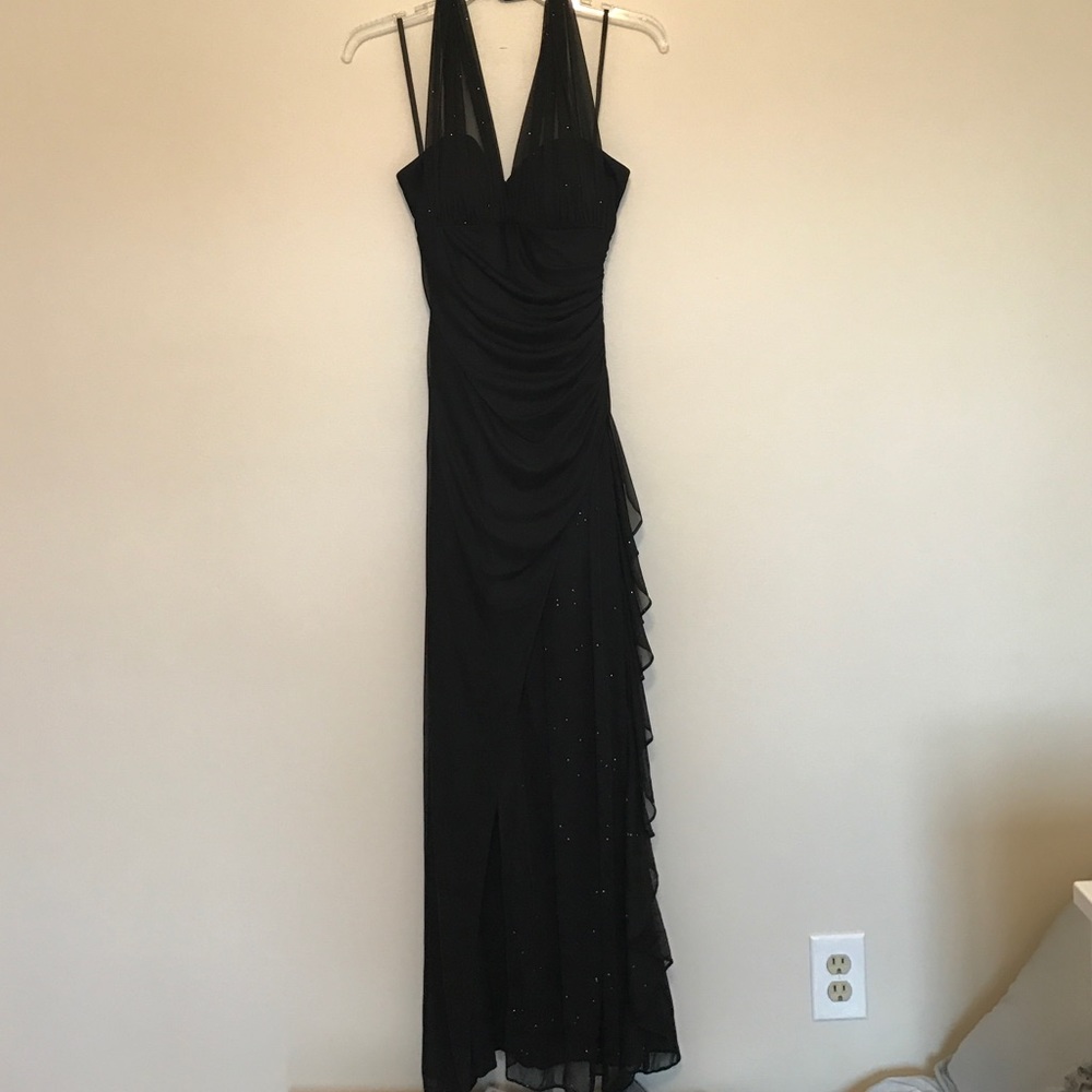 Black, long, formal dress with sheer detailing.