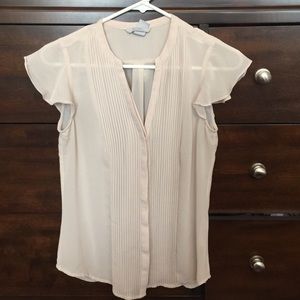 Cream sheer blouse.