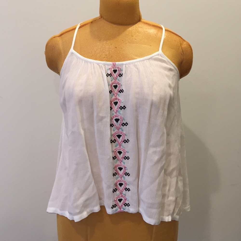 White blouse with beaded pattern on the front