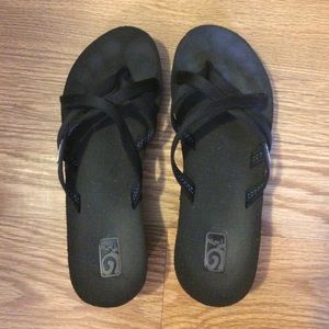 Black Teva flip flops