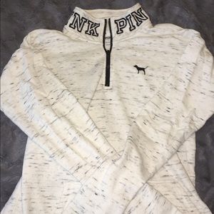 white and black speckled half zip-up