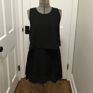 Black dress with pleated skirt