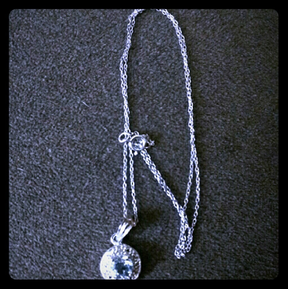 Blue Topaz and Diamond pendant