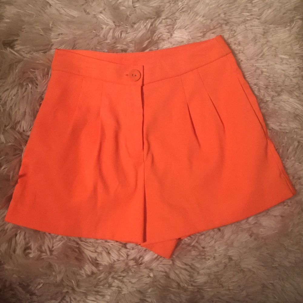 High waisted bright orange shorts