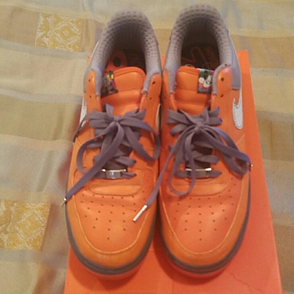 Nike Air Force Ones slightly worn.