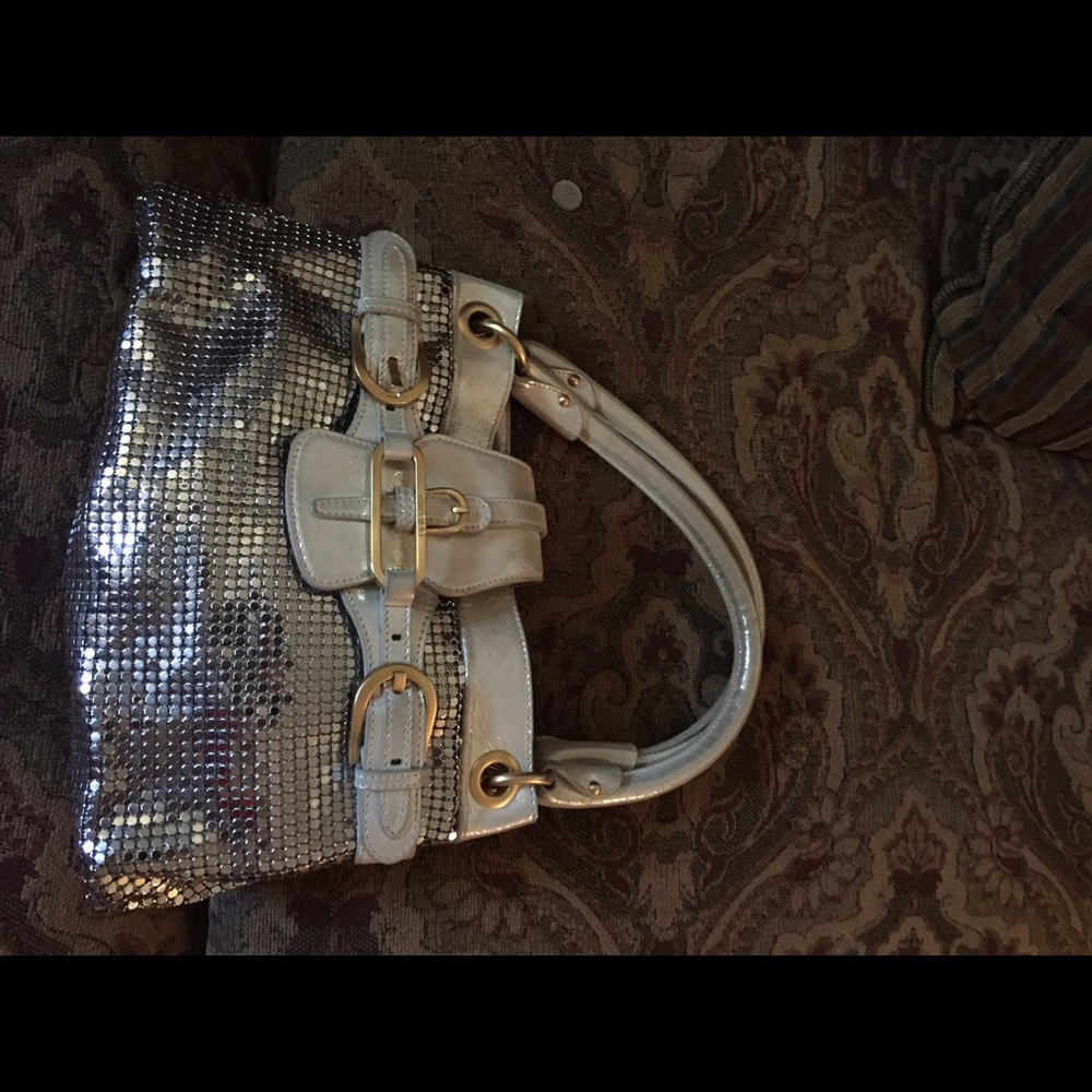 I am selling my jimmy choo. Purse.