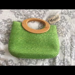 Green straw purse with wooden handles.