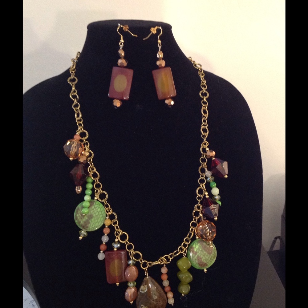 Beads, stones and gold color chain.