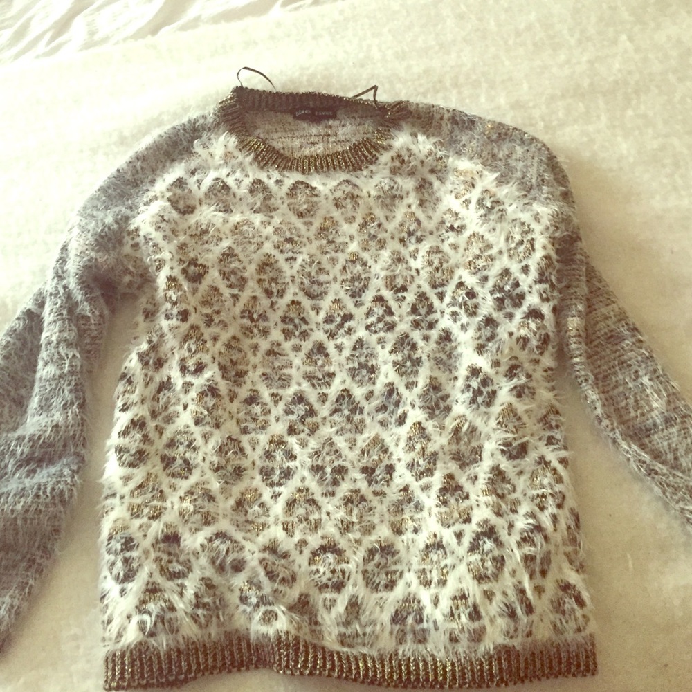 Black, gold, and white sweater