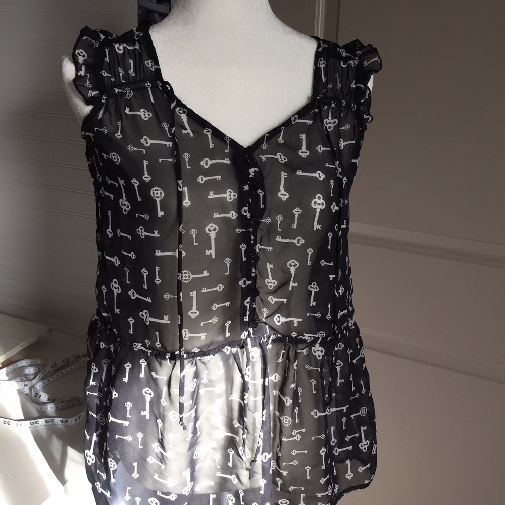 Sheer sleeveless tunic style top