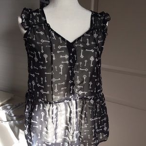 Sheer sleeveless tunic style top