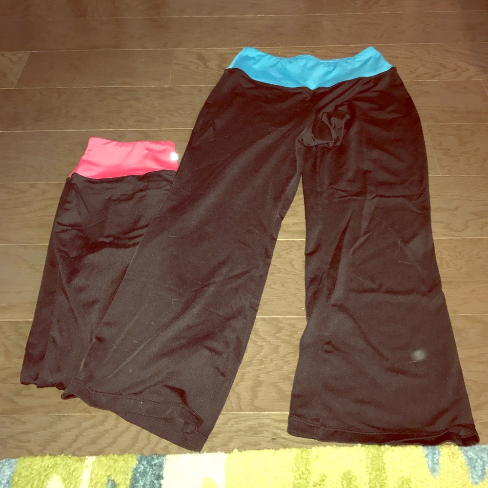 Two pairs of FILA cropped work out pants.