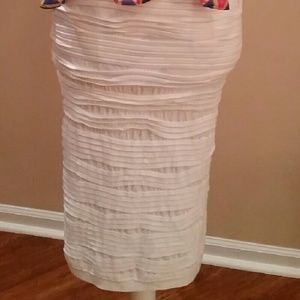 Knee length white skirt