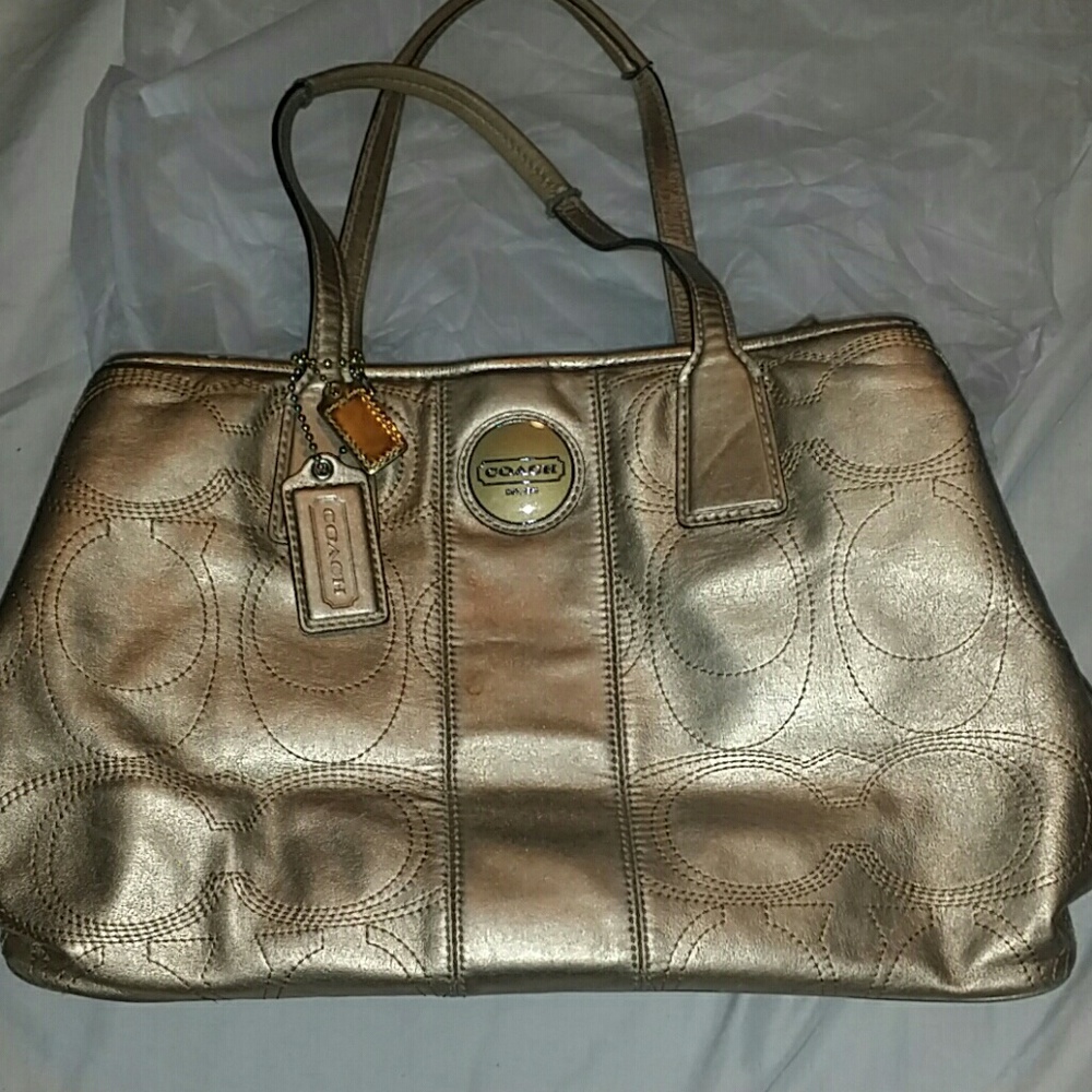 Gold coach bag