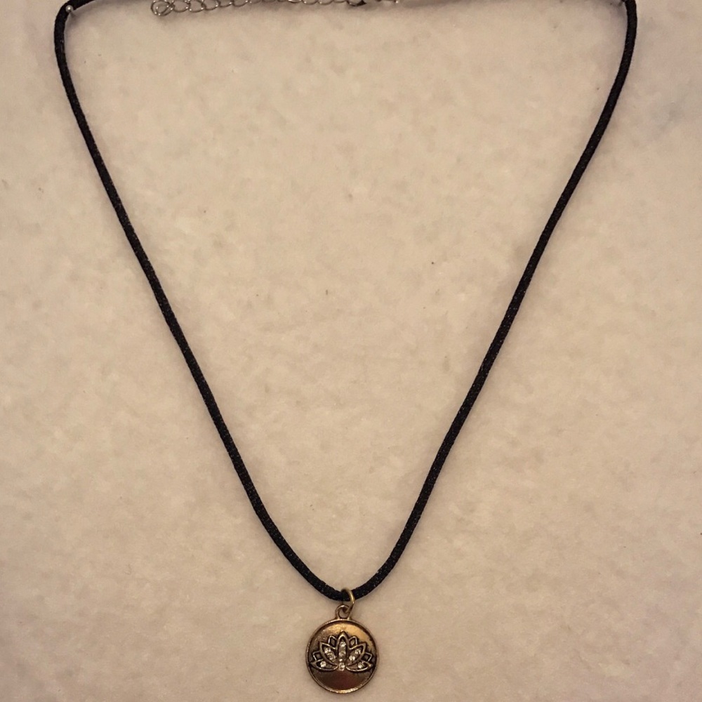 Lotus flower golden charm necklace.