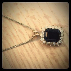 Gold necklace with black stone