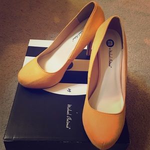Mustard suede pumps